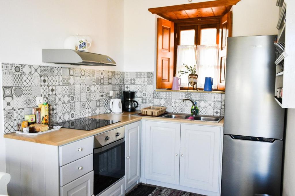 Kuchyň nebo kuchyňský kout v ubytování Apartment Nektarios