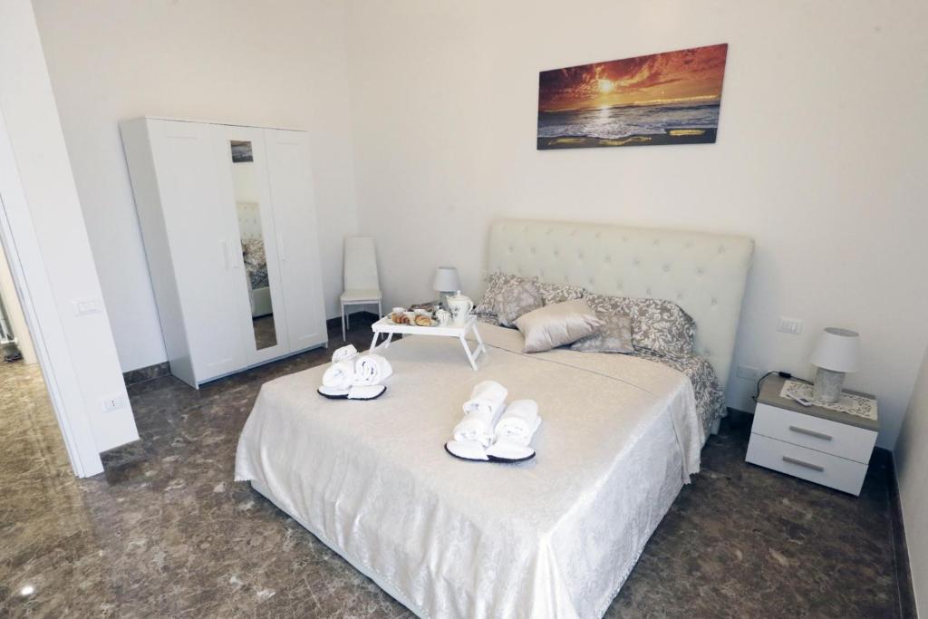 Postel nebo postele na pokoji v ubytování L'ARTE DI VENERE SUITE