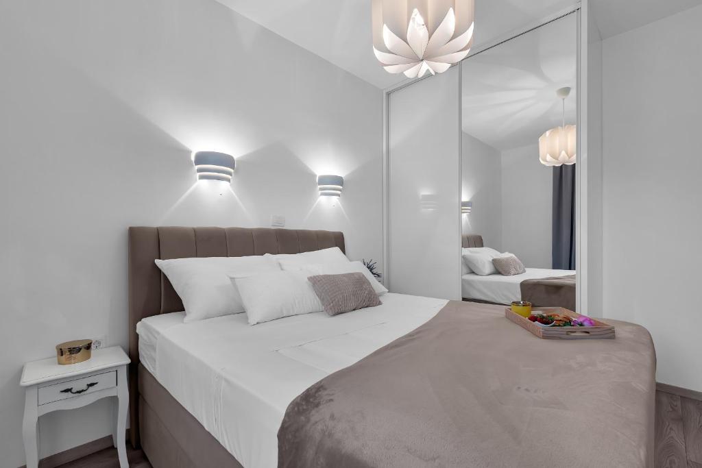 Postel nebo postele na pokoji v ubytování Apartment Apricus
