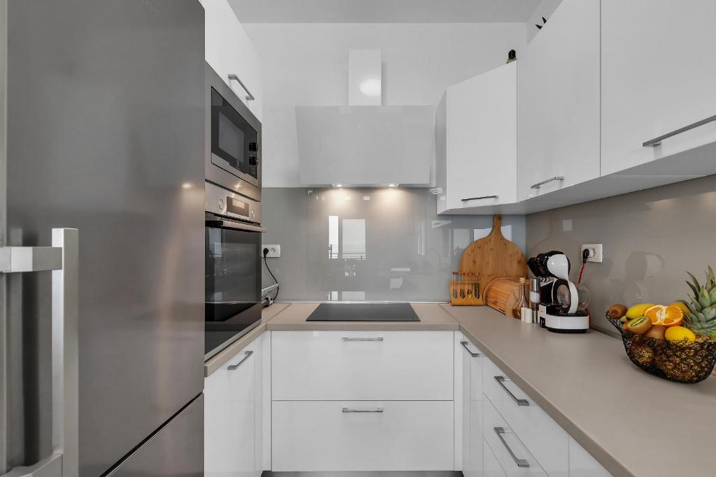 Kuchyň nebo kuchyňský kout v ubytování Apartment Apricus