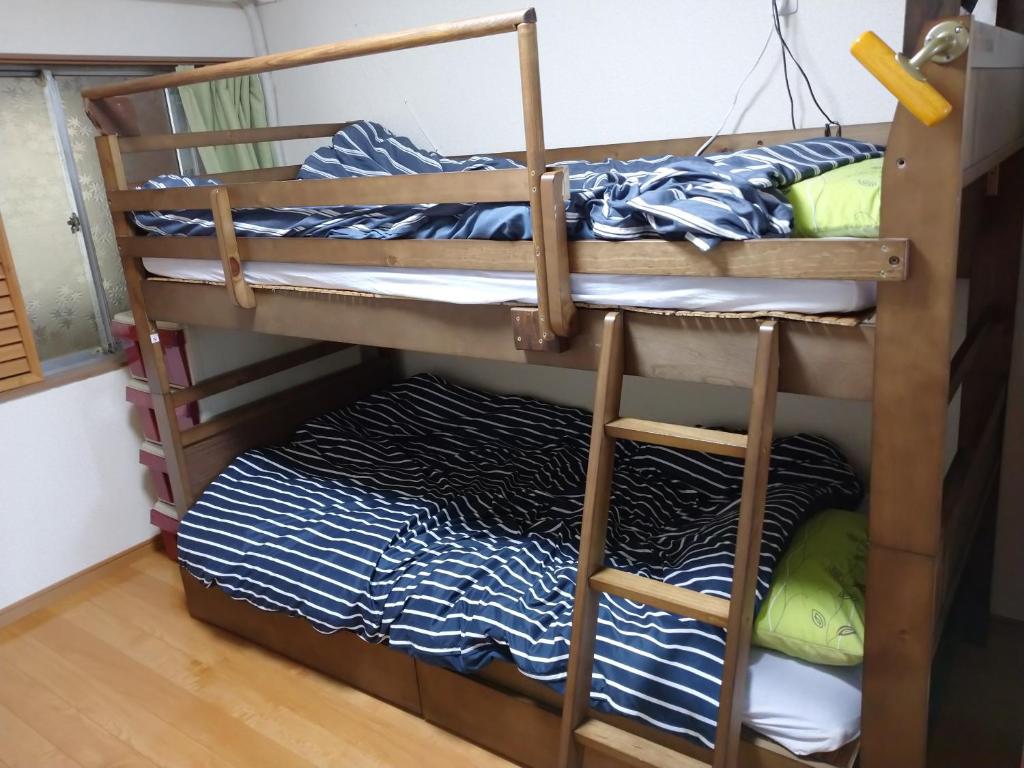 Letto o letti in una camera di コウノトリの里の宿