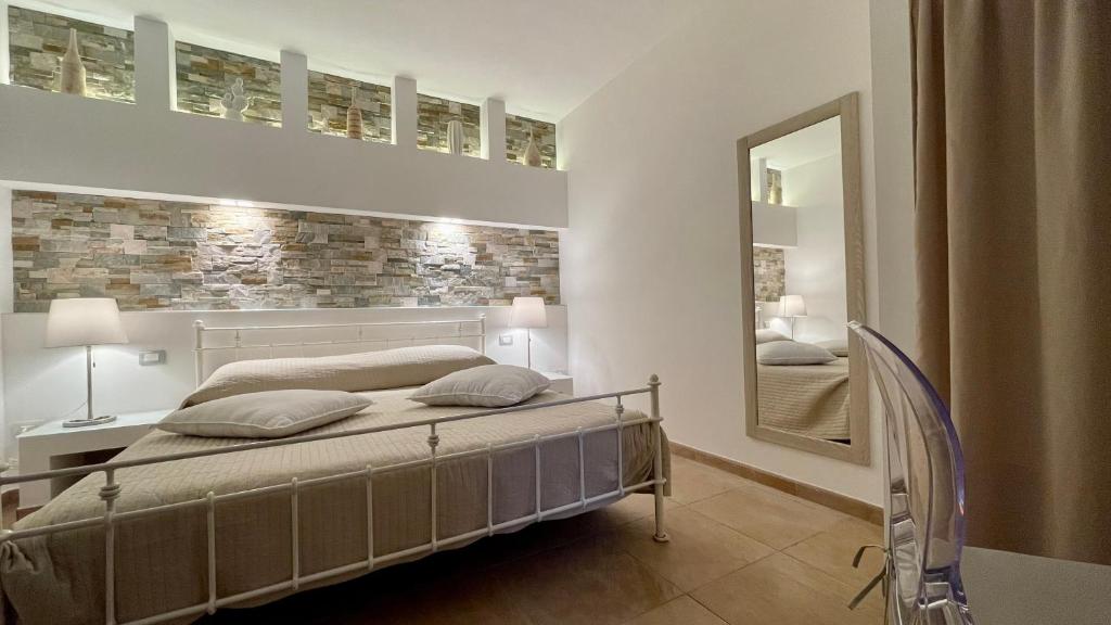 Ένα ή περισσότερα κρεβάτια σε δωμάτιο στο Borgo del Nespolo