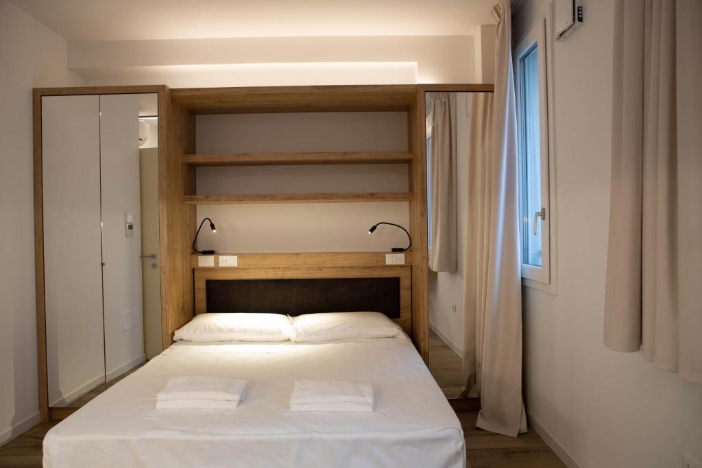 Łóżko lub łóżka w pokoju w obiekcie Vespasiani Suites