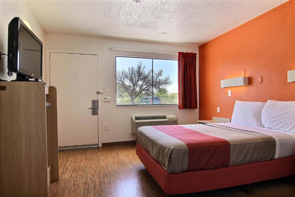 a hotel room with a bed and a window at Motel 6-Abilene, TX in Abilene