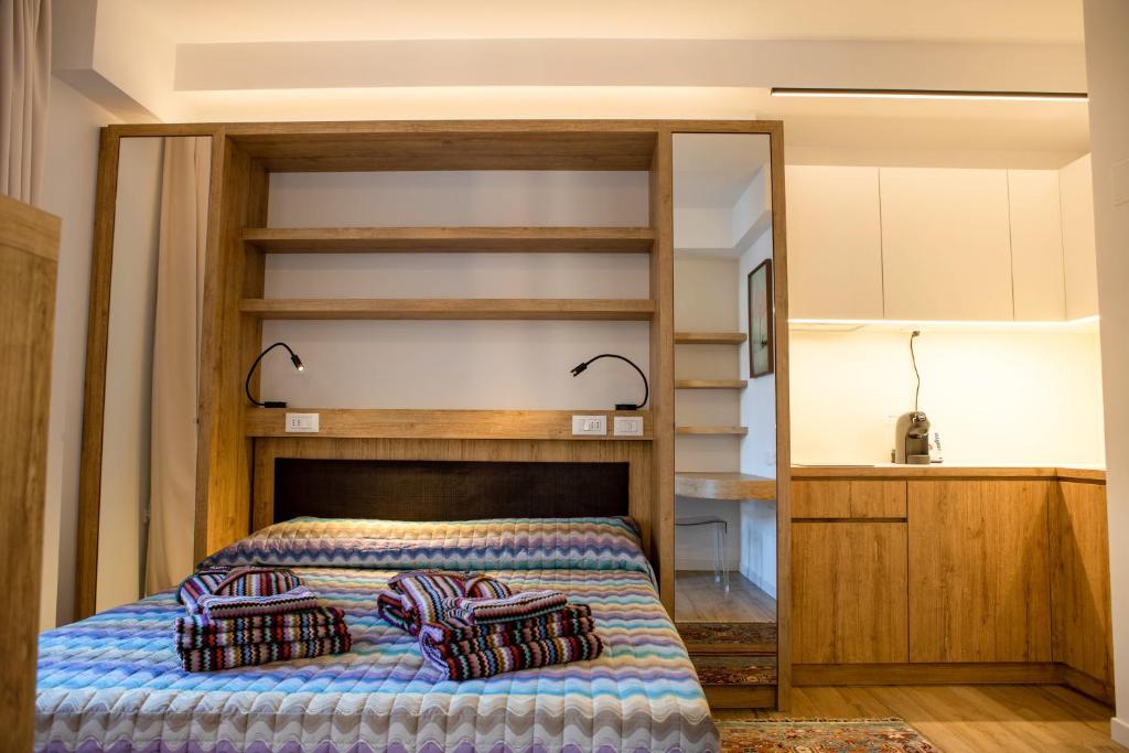 Łóżko lub łóżka w pokoju w obiekcie Vespasiani Suites