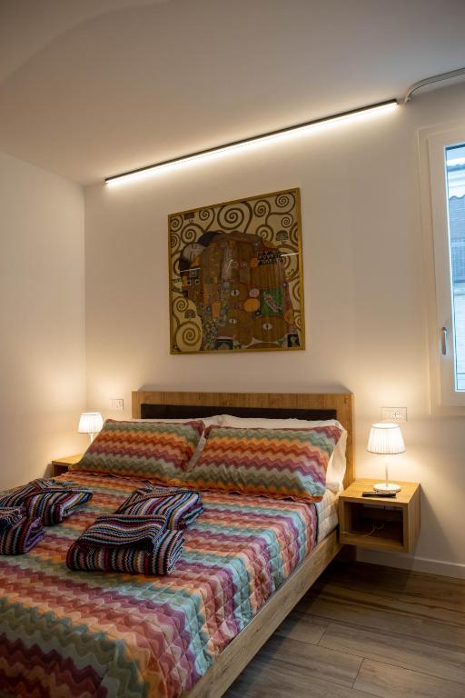 Łóżko lub łóżka w pokoju w obiekcie Vespasiani Suites