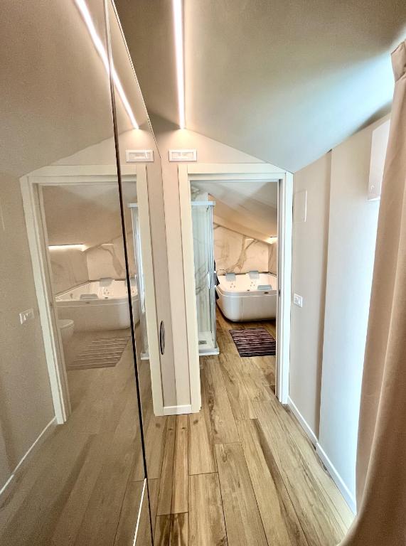 Łóżko lub łóżka w pokoju w obiekcie Vespasiani Suites