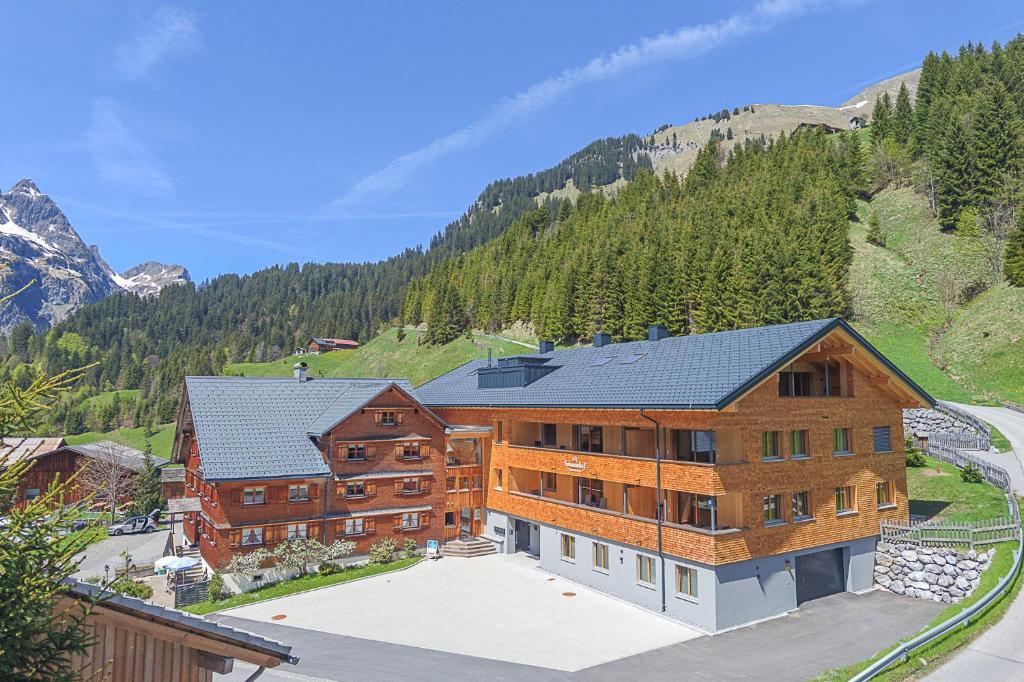 an overhead view of a large building in the mountains at Sonnenhof Appartements in Schröcken