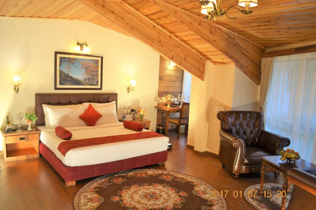 En eller flere senger på et rom på Crescent Resort, Darjeeling