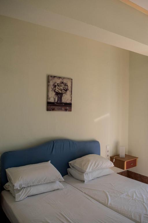 Postel nebo postele na pokoji v ubytování Mirtia Hotel