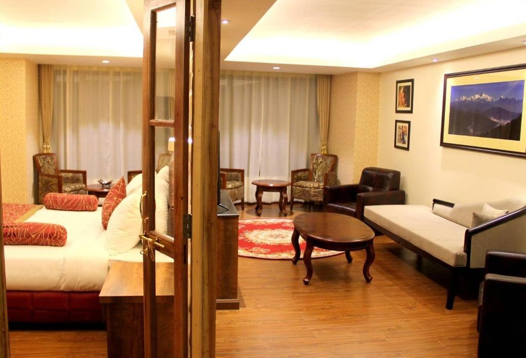 Postel nebo postele na pokoji v ubytování Crescent Resort, Darjeeling