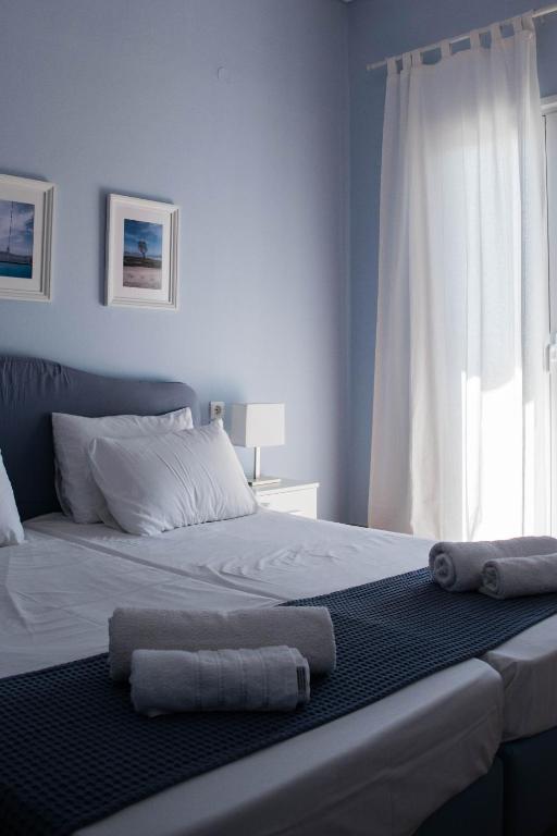Postel nebo postele na pokoji v ubytování Mirtia Hotel
