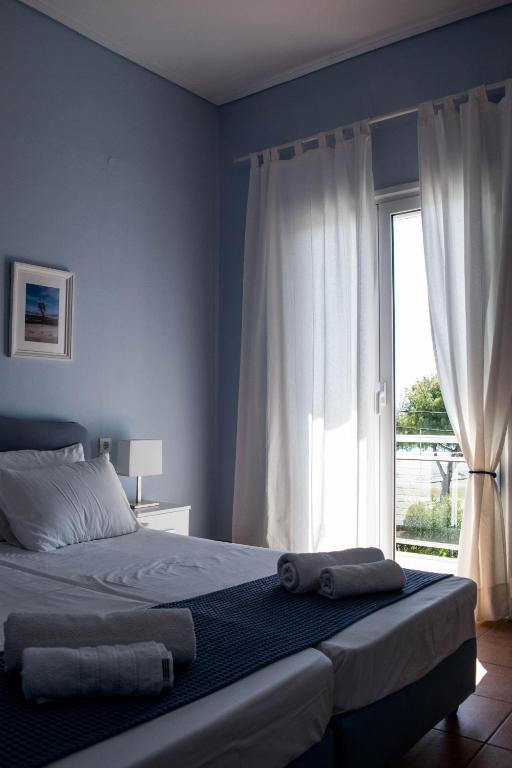 Postel nebo postele na pokoji v ubytování Mirtia Hotel