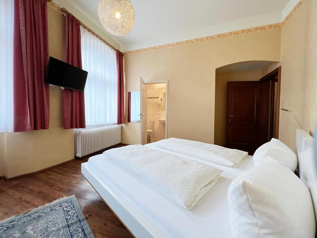 Postel nebo postele na pokoji v ubytování Hotel Kühler Krug