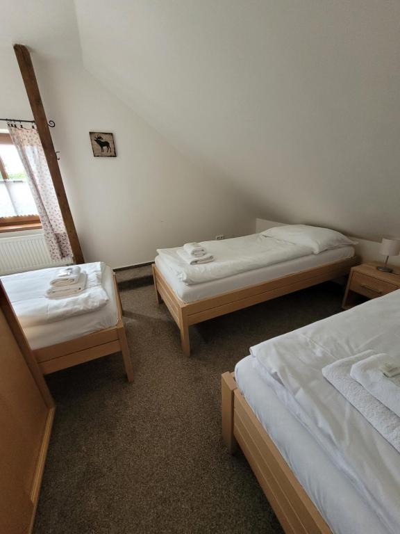 Postel nebo postele na pokoji v ubytování Chata Kvilda