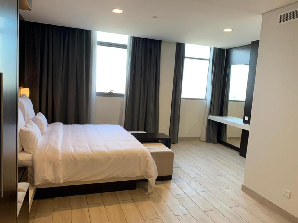 Postel nebo postele na pokoji v ubytování Mirot Hotel