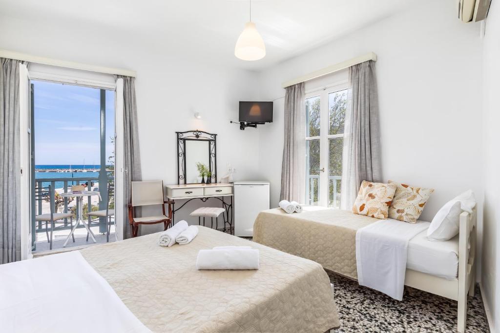 Postel nebo postele na pokoji v ubytování Marialena Rooms