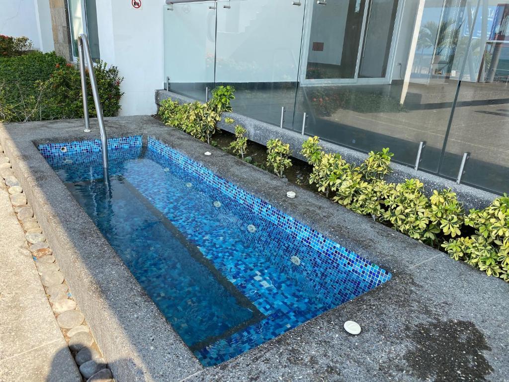 Bazén v ubytování Resort Playa Azul Departamentos nebo v jeho okolí