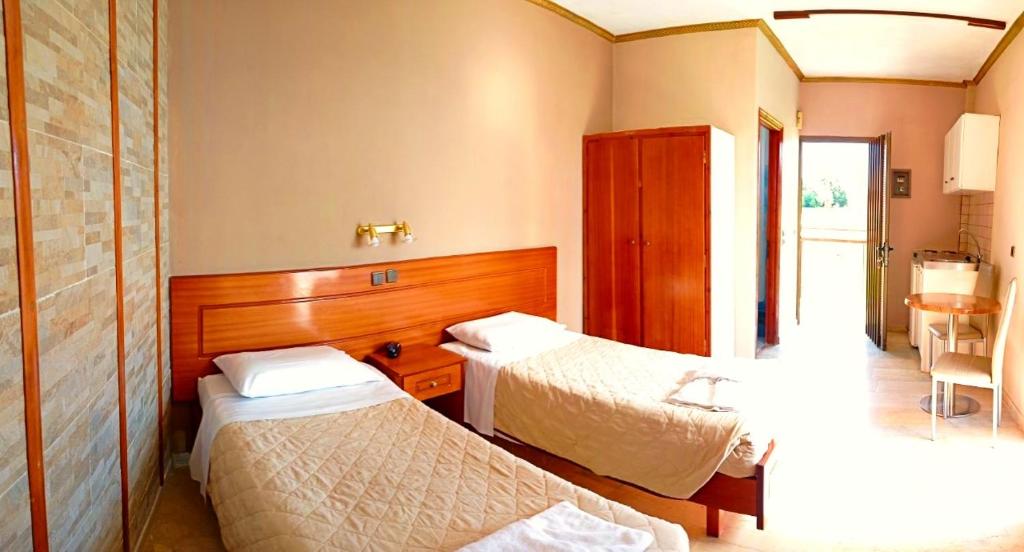 A bed or beds in a room at Maria's Beach Apartments