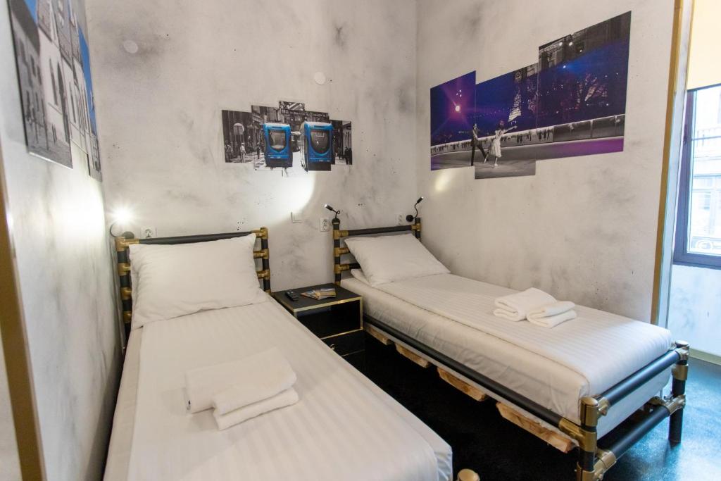 Postel nebo postele na pokoji v ubytování Timeout Heritage Hotel Zagreb