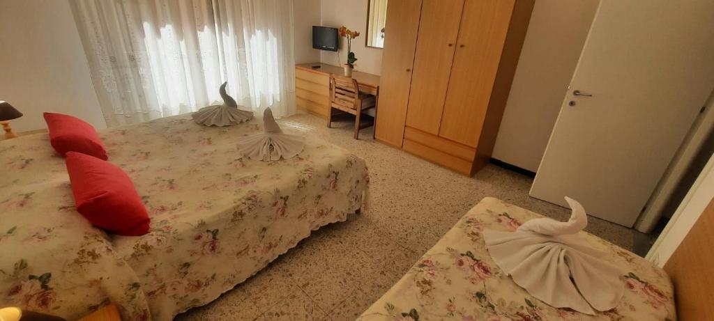 Postel nebo postele na pokoji v ubytování Hotel Dora