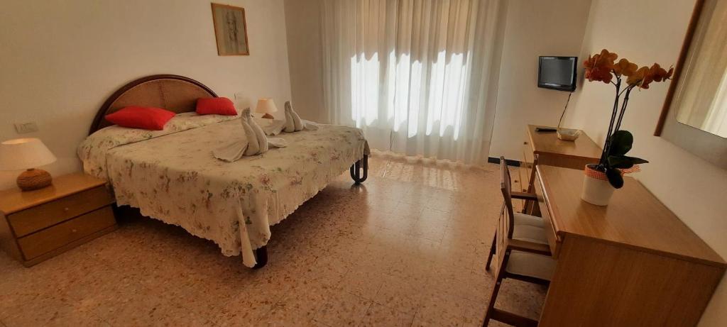Postel nebo postele na pokoji v ubytování Hotel Dora