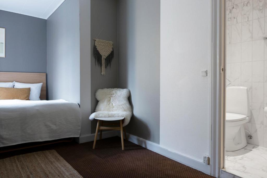 Postel nebo postele na pokoji v ubytování Savoy Hotel