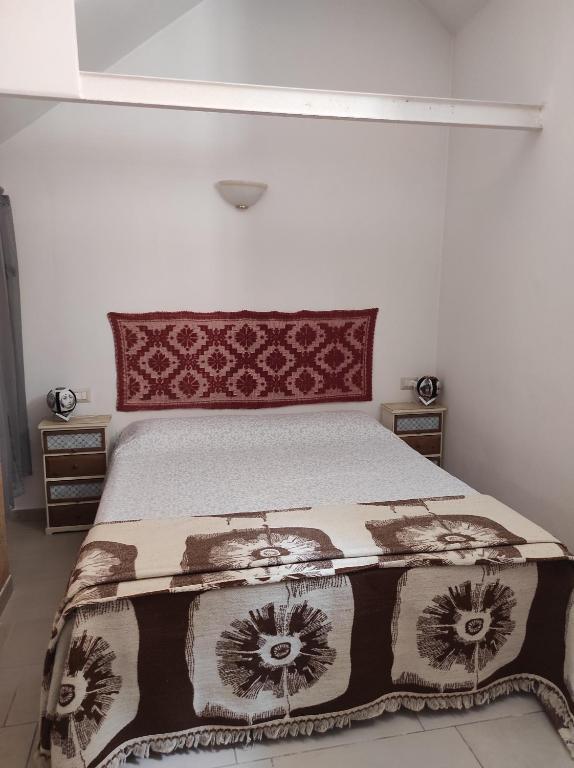 A bed or beds in a room at Appartamento Marta
