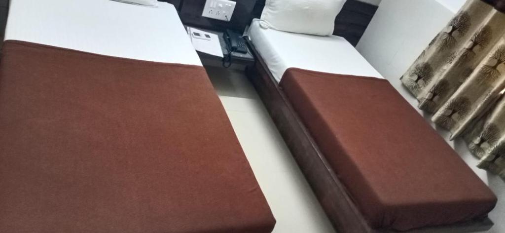 Postel nebo postele na pokoji v ubytování Homestayinn