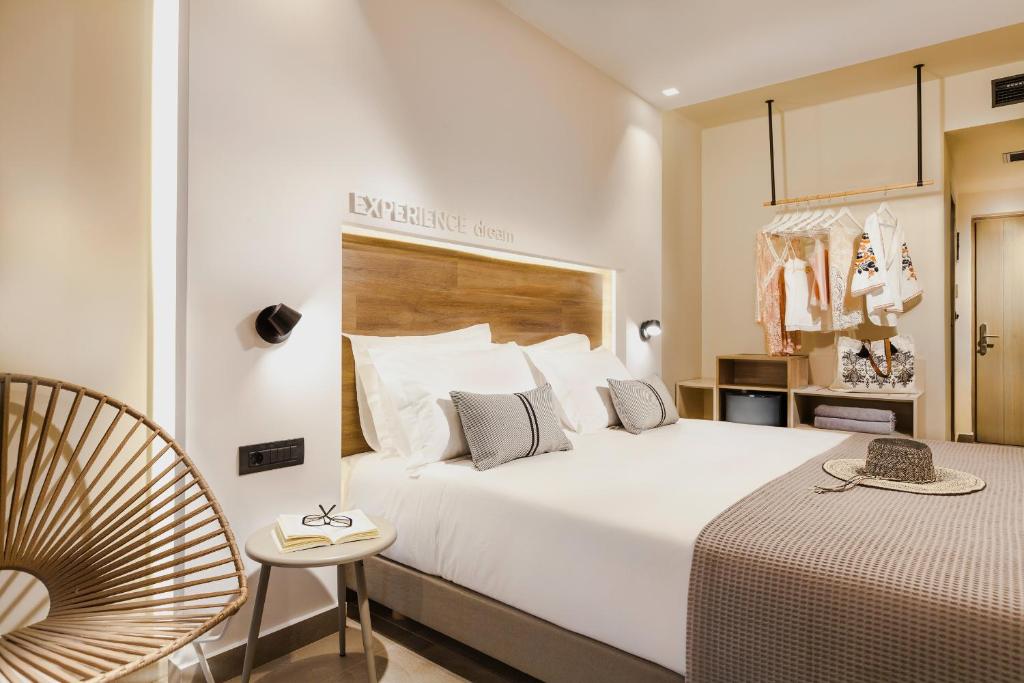 A bed or beds in a room at Carian Hotel
