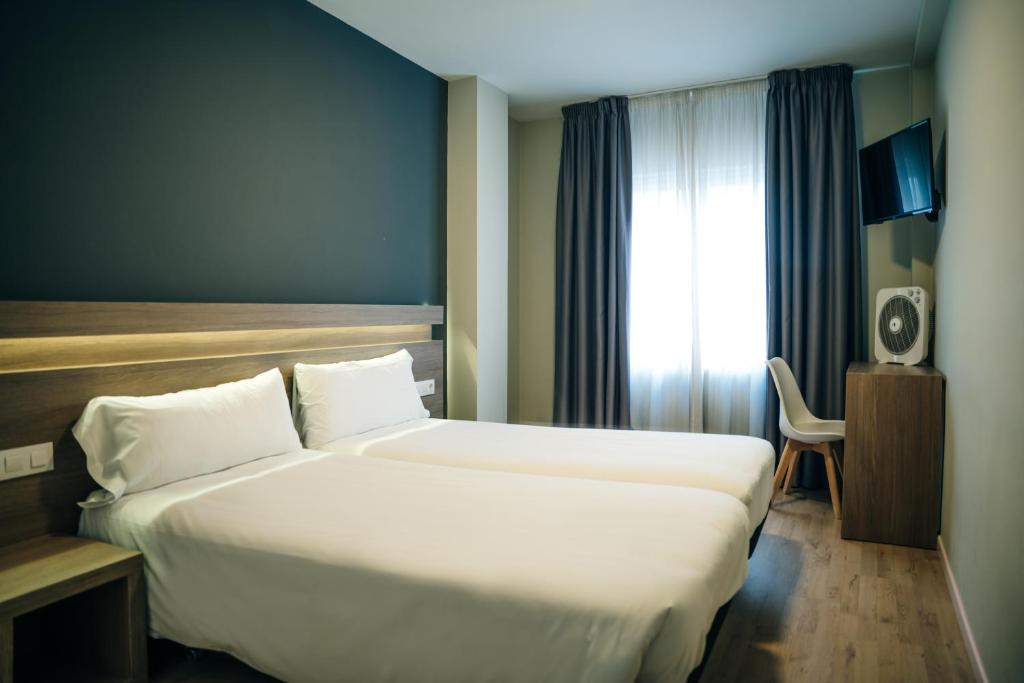 Cama o camas de una habitación en Hotel Alda Estación Pontevedra