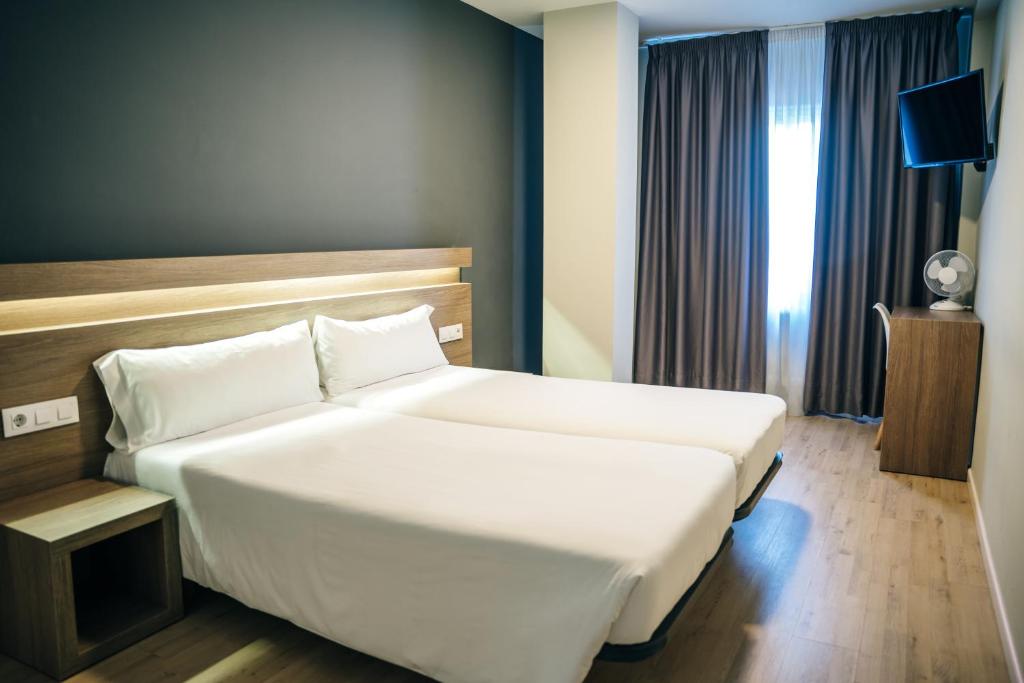 Cama o camas de una habitación en Hotel Alda Estación Pontevedra