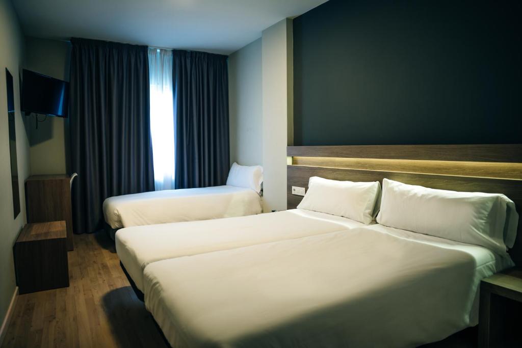 Cama o camas de una habitación en Hotel Alda Estación Pontevedra