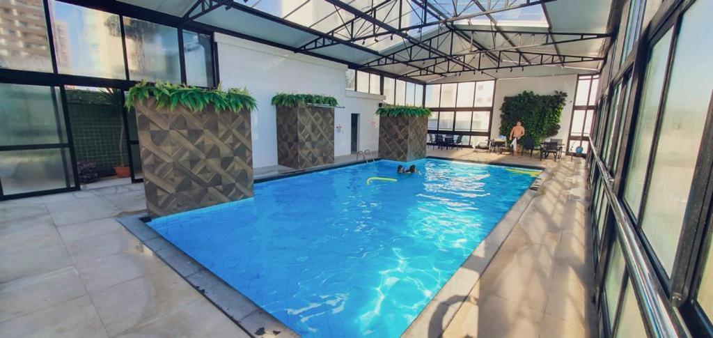 an overhead view of a swimming pool in a building at Hotel das Américas in Balneário Camboriú