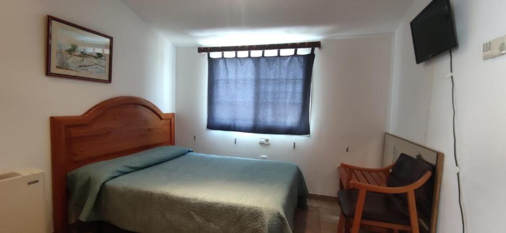Postel nebo postele na pokoji v ubytování Hostal Restaurant Paca