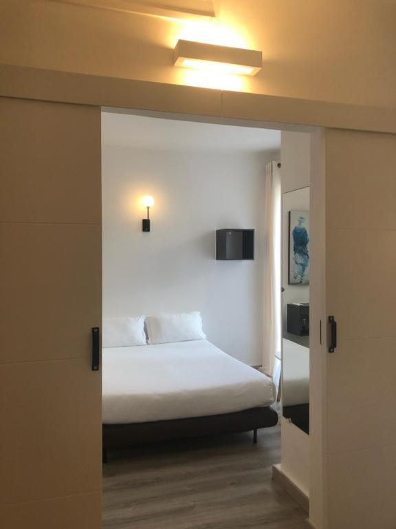 Postel nebo postele na pokoji v ubytování Hotel Marengo