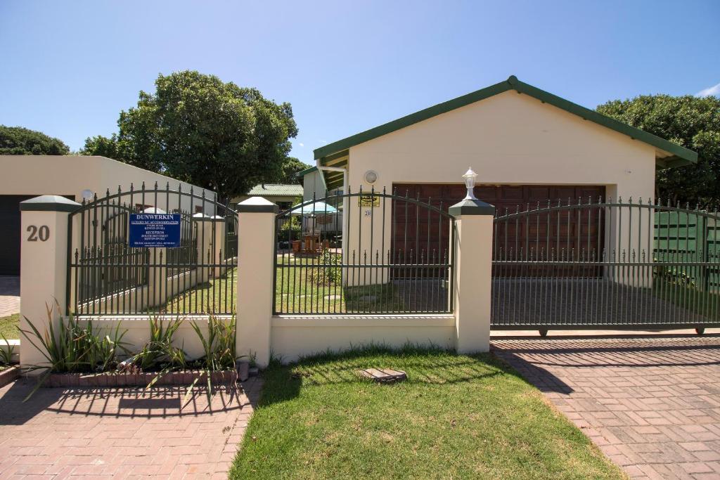 a gate in front of a house at Dunwerkin Bachelor Flat in Kenton on Sea