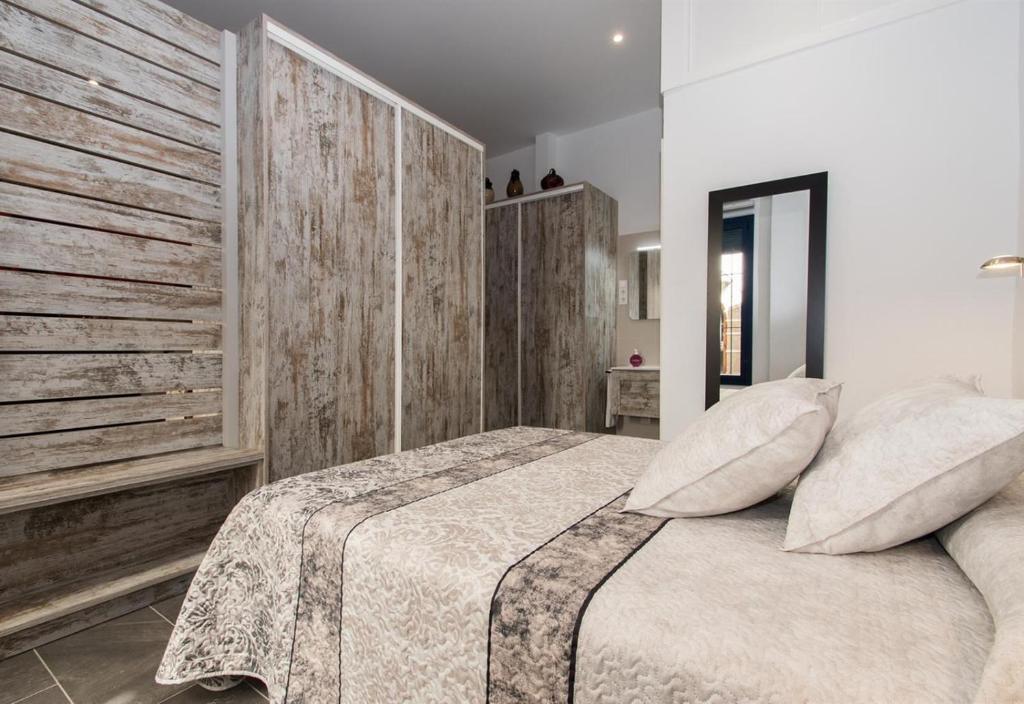 Postel nebo postele na pokoji v ubytování Petit Loft