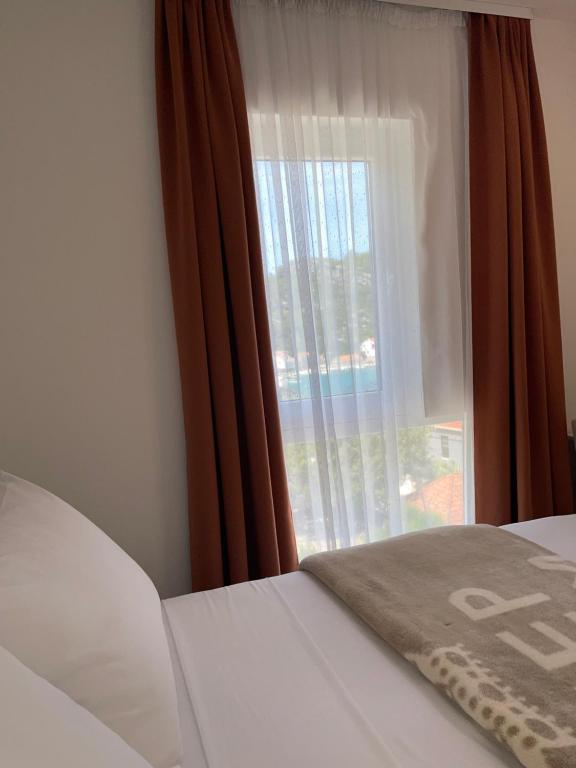 Postel nebo postele na pokoji v ubytování Villa Evita Apartments