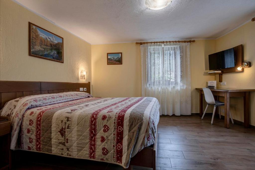 Postel nebo postele na pokoji v ubytování Hotel Cecchin