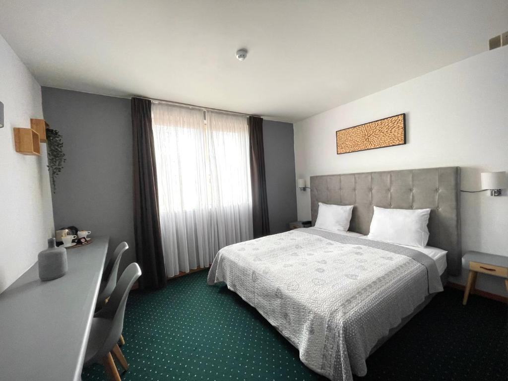 Postel nebo postele na pokoji v ubytování Hotel De Fierlant