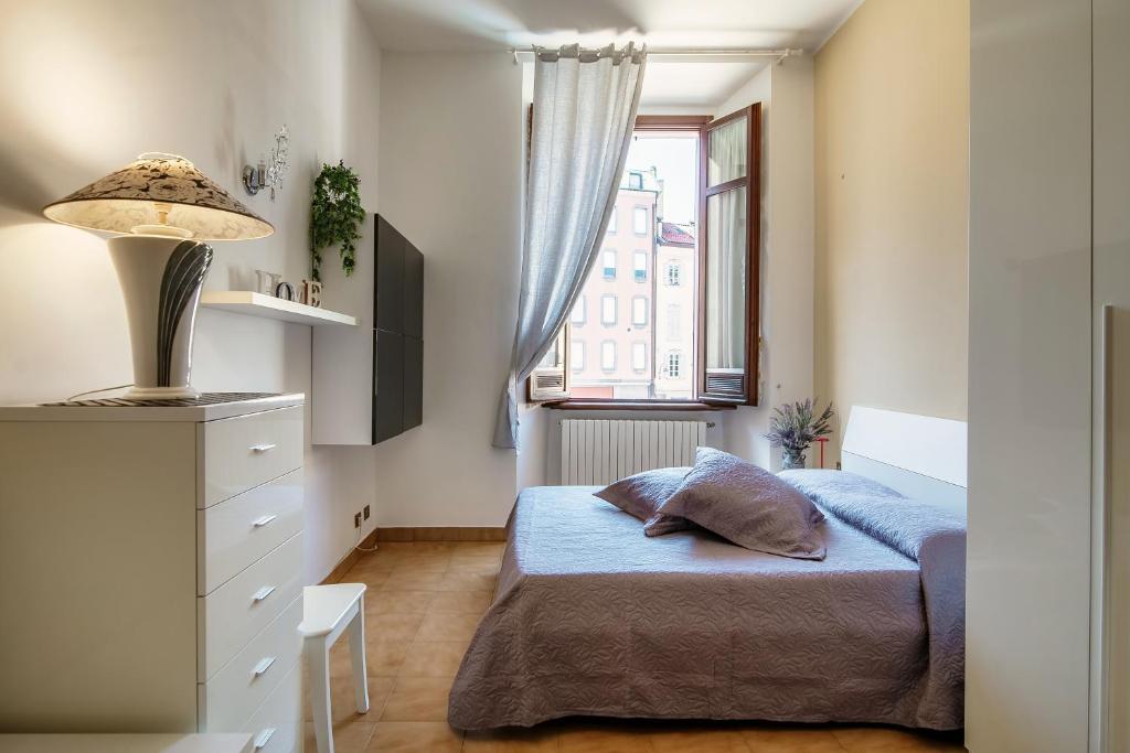 Ένα ή περισσότερα κρεβάτια σε δωμάτιο στο Mazzini Apartment