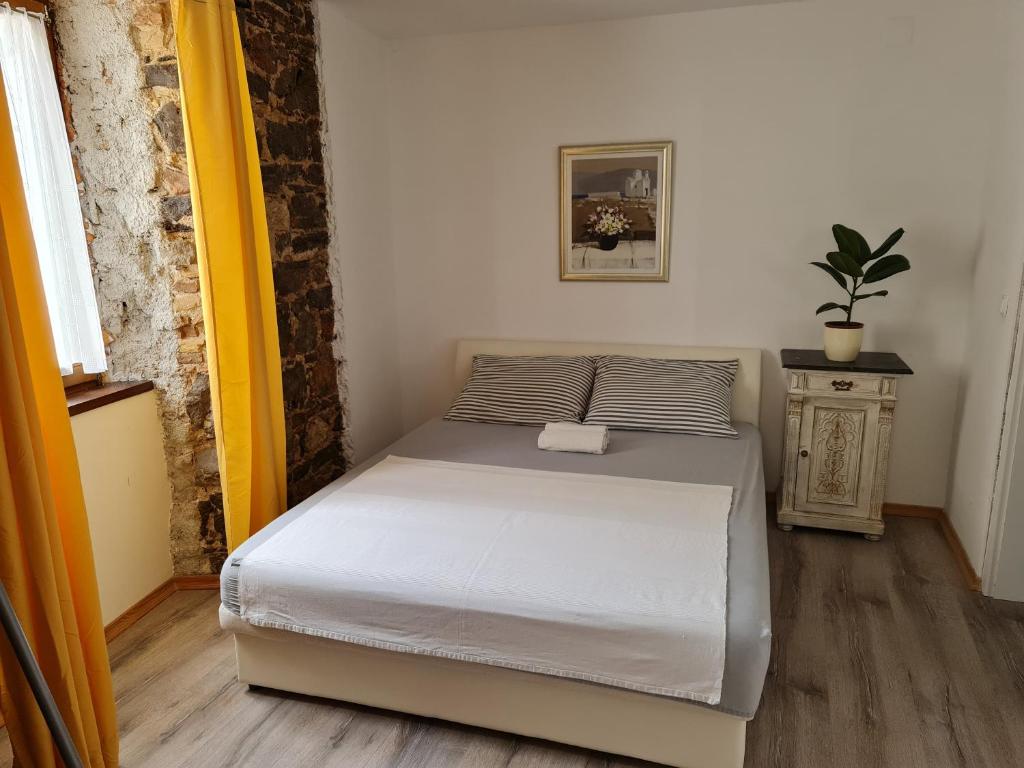 Posteľ alebo postele v izbe v ubytovaní Rustic