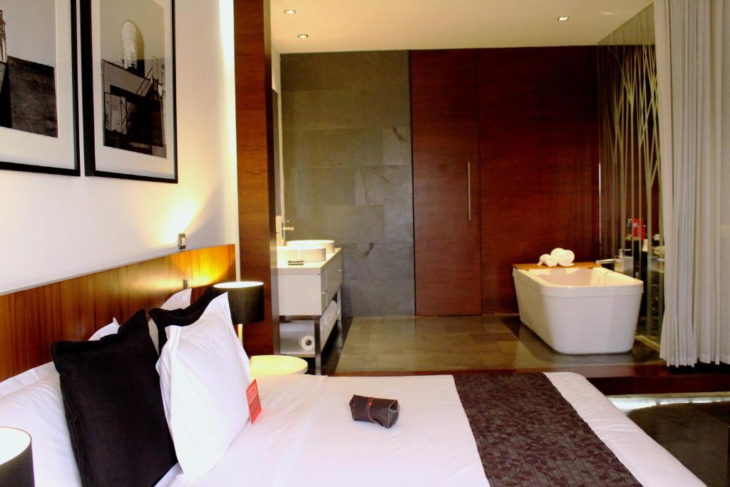 Ένα ή περισσότερα κρεβάτια σε δωμάτιο στο BTH Hotel – Boutique Concept
