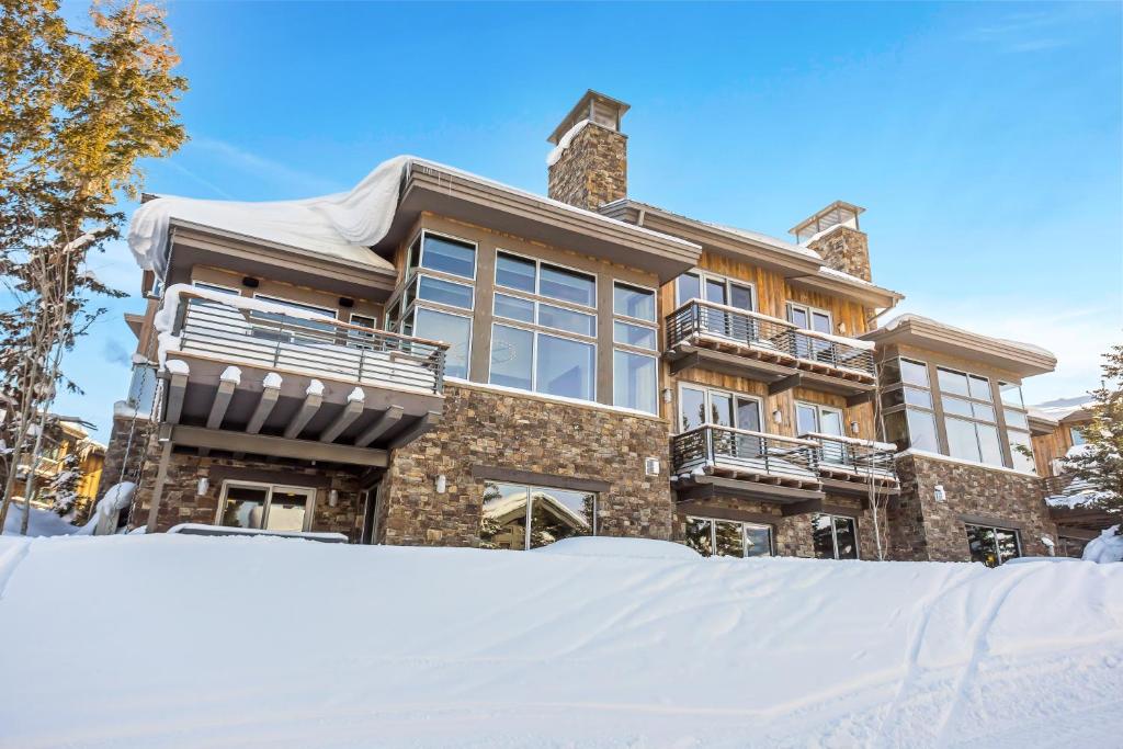 a house with snow in front of it at Luxury Five Bedroom Private Home with stunning Park City views home in Park City