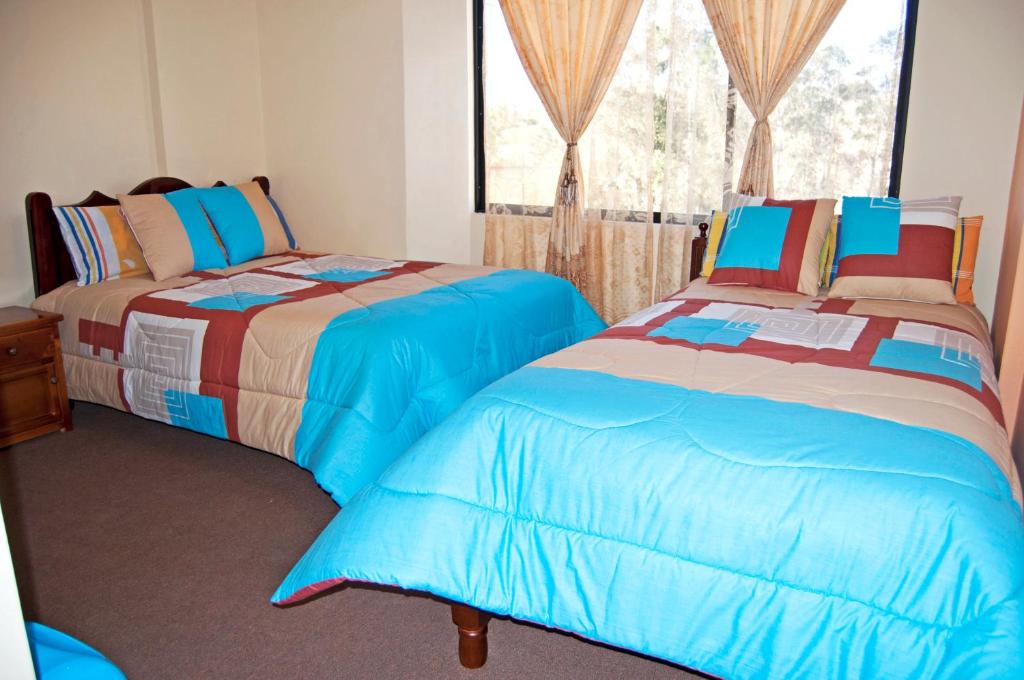 Lova arba lovos apgyvendinimo įstaigoje Hotel Residencial El Viajero