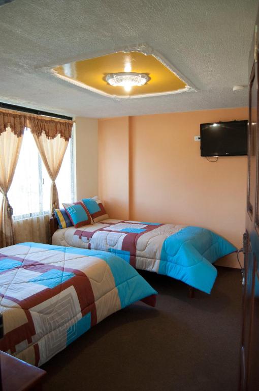 Postel nebo postele na pokoji v ubytování Hotel Residencial El Viajero
