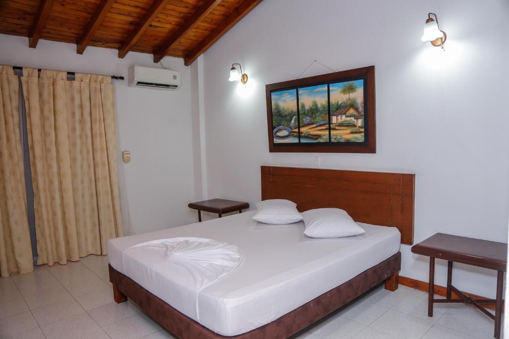 Postel nebo postele na pokoji v ubytování Hotel y Restaurante Mesón del Gitano