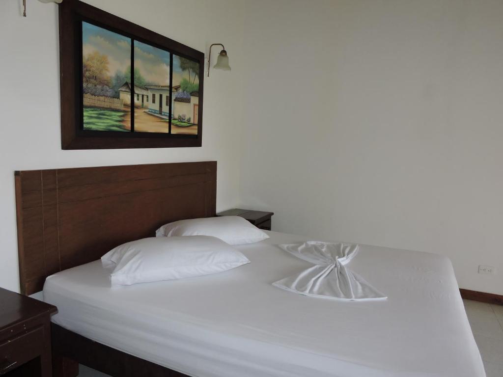 Postel nebo postele na pokoji v ubytování Hotel y Restaurante Mesón del Gitano