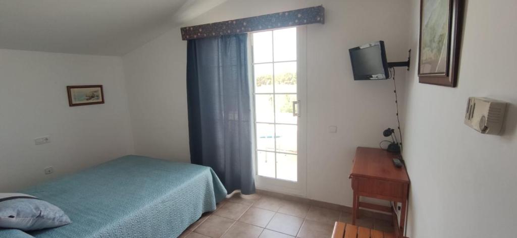 Postel nebo postele na pokoji v ubytování Hostal Restaurant Paca